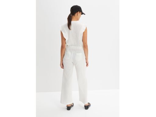 B.P.C kombinezon beżowy bawełniany z falbanką 44.